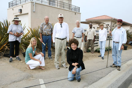 (Left to right) Muriel Janes, Kendra La Salle (Junior Women's Club), Bell Kendall (Garden Club), Al Werker, Kelly Comras, Lew Whitaker, Anderson Marshall (L.A. County), Pam Kendall (Garden Club) and Doug McCormick have all given time or money to support a cleanup and planting project at Will Rogers beach at Castle Rock.